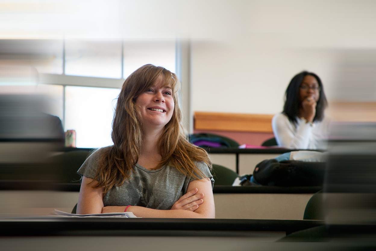 A female student smiles in Daleah Goodwin's class at UGA